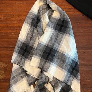 Kensie poncho in black and white plaid. Cotton blend. Fringe edging. OS